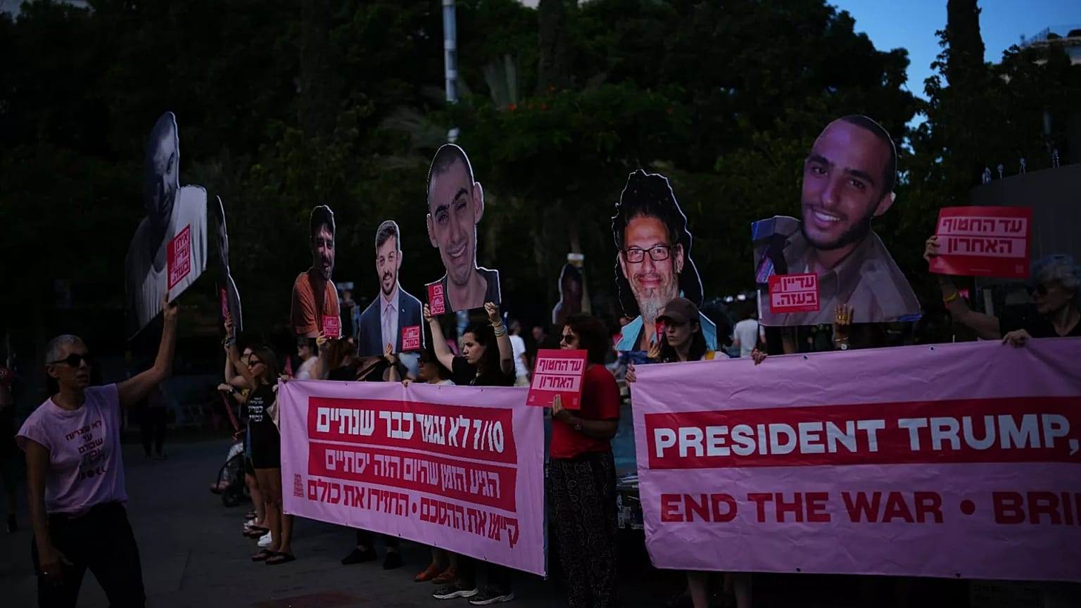 People gather at a memorial marking two years anniversary of the deadly Hamas attack on Israel, Tel Aviv, Israel, Tuesday, Oct. 7, 2025. 