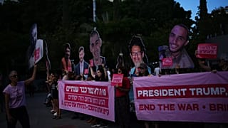 People gather at a memorial marking two years anniversary of the deadly Hamas attack on Israel, Tel Aviv, Israel, Tuesday, Oct. 7, 2025. 