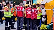 Emergency personnel work at the site of a building collapse in Madrid, Spain, on Tuesday, 7 October 2025