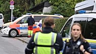 Police and emergency services stand on a street in Herdecke, 7 October, 2025