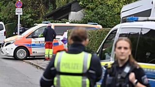 Police and emergency services stand on a street in Herdecke, 7 October, 2025