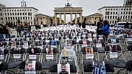 More than 1,000 chairs with photos of the murdered victims are set up in Berlin to commemorate the second anniversary of Hamas' terrorist attack on Israel. (AP Photo)