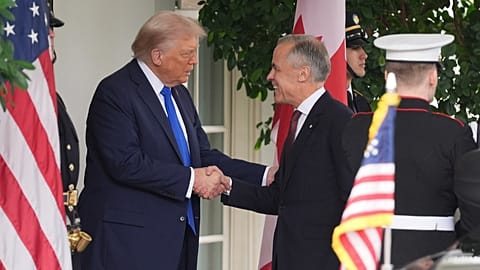 President Donald Trump greets Canadian Prime Minister Mark Carney at the White House, Tuesday, Oct. 7, 2025, in Washington