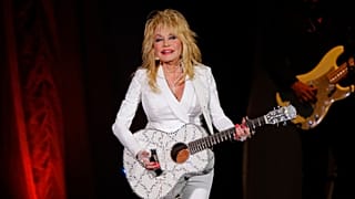 Dolly Parton's sister asks fans to pray for the singer as she faces ‘health challenges’ - Pictured: Dolly live on stage - 2015