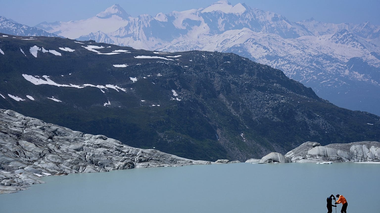 Researchers prepares camera at the Rhone Glacier near Goms, Switzerland, on June 10, 2025. Photo by Matthias Schrader