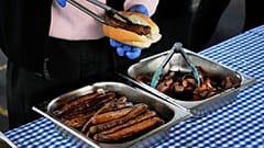 FILE: A worker prepares a "Democracy Sausage" at the Marrickville Public School in Sydney, 3 May 2025