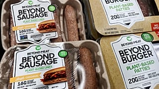 Beyond Meat products are seen in a refrigerated case inside a grocery store.