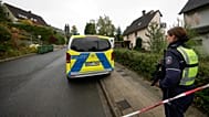 A police officer stands at a blocked road in Herdecke, Germany, Tuesday, Oct. 7, 2025