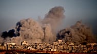 Smoke rises following an Israeli military strike in the northern Gaza Strip, seen from southern Israel, Wednesday, Oct. 8, 2025