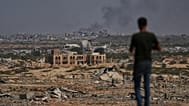 FILE: Smoke rises in Gaza City as seen from the central Gaza Strip, 8 October 2025