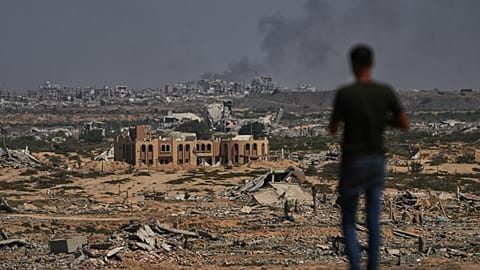 FILE: Smoke rises in Gaza City as seen from the central Gaza Strip, 8 October 2025