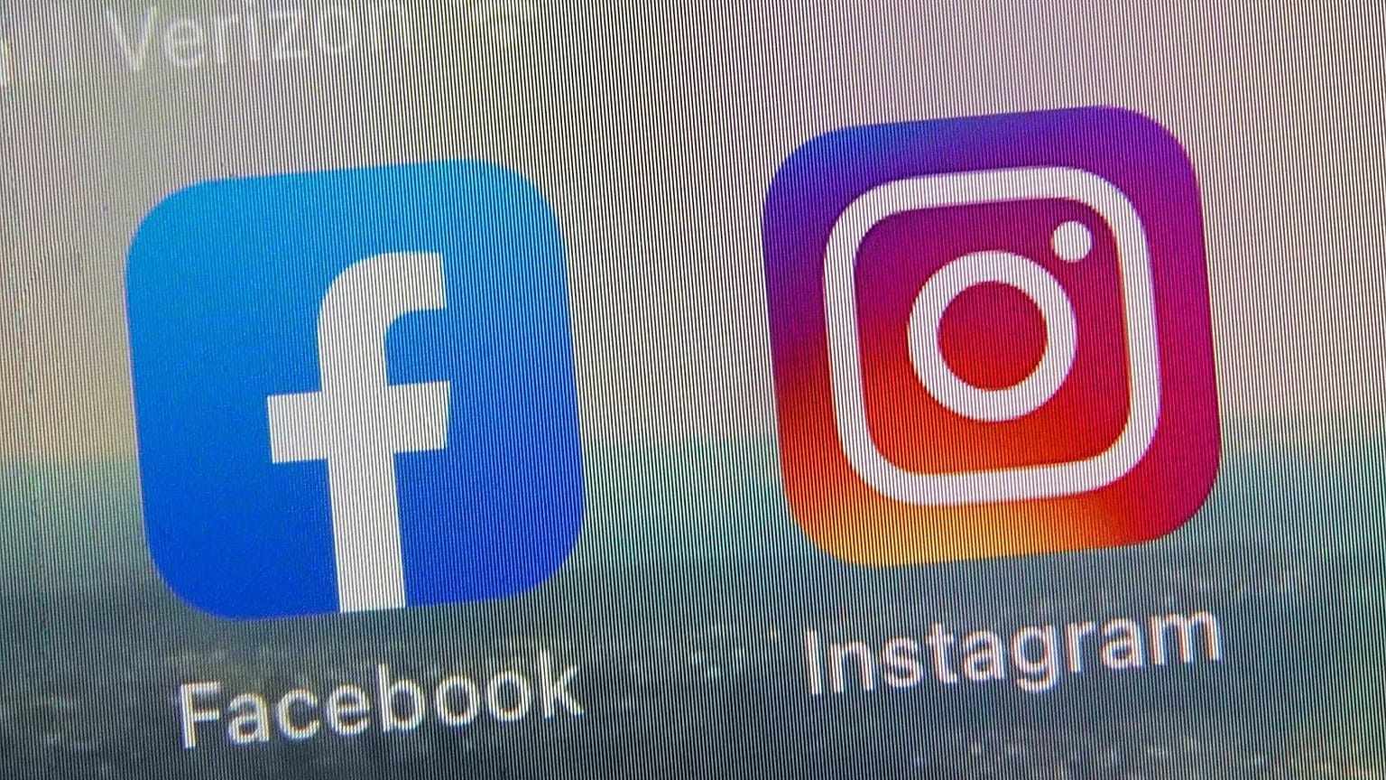 This file photo shows the mobile phone app logos for Facebook and Instagram on Oct. 5, 2021. 