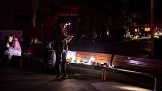 A man sells battery-powered radios and torches on a Barcelona street during the blackout in Barcelona, 29 April, 2025