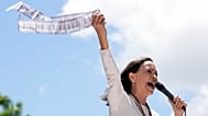 Venezuelan opposition leader Maria Corina Machado holds up tally sheets during a protest against the reelection of President Nicolás Maduro, 28 August 2024