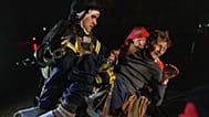 Rescuers carry an injured woman into an ambulance after a Russian strike on a residential neighborhood in Kyiv, Ukraine, on Friday, Oct. 10, 2025.