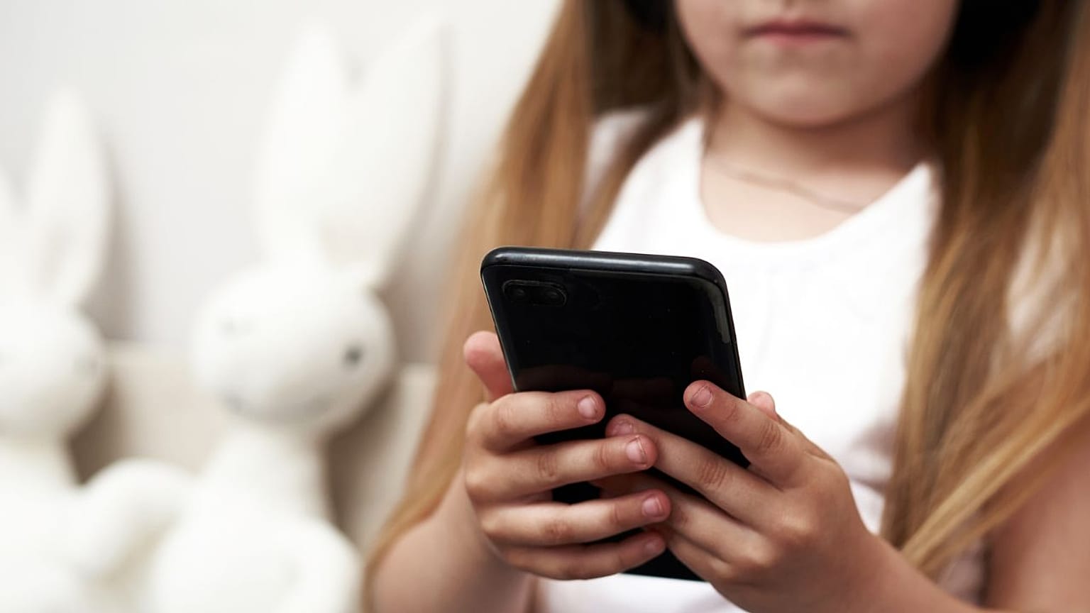 Child using phone.