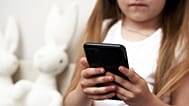 Child using phone.