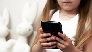 Child using phone.