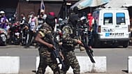 Police patrol the streets during a protest calling for the president to step down in Antananarivo, Madagascar, Thursday, Oct. 9, 2025. (AP Photo/Alexander Joe)