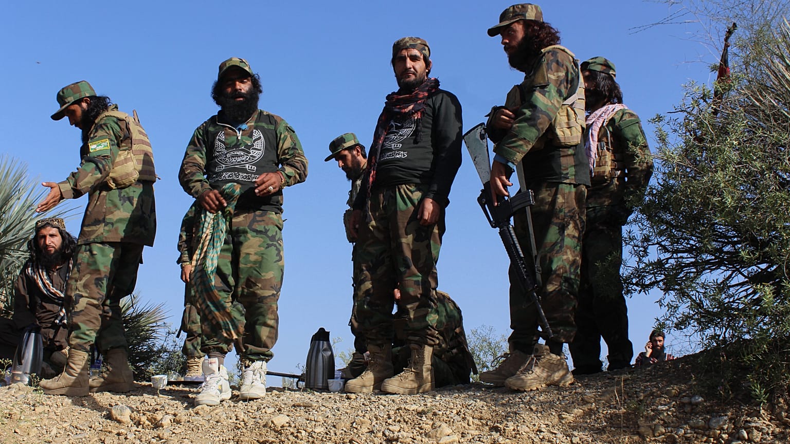 Afghan servicemen guard along the border in the Zazai Maidan district of Khost province, Afghanistan, Sunday, Oct. 12, 2025, after overnight clashes with Pakistan's forces. 