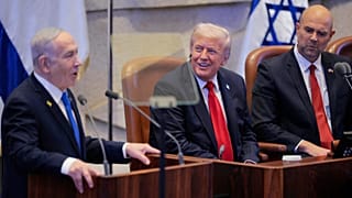 Israeli Prime Minister Benjamin Netanyahu addresses the parliament as US President Donald Trump and Speaker Amir Ohana look on at the Knesset, 13 October 2025