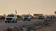 ICRC vehicles transporting released Israeli hostages head toward the Israeli border