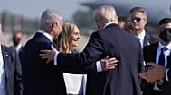 President Donald Trump greets Israel's Prime Minister Benjamin Netanyahu, as he arrives at Ben Gurion International Airport, Monday, Oct. 13, 2025, near Tel Aviv.