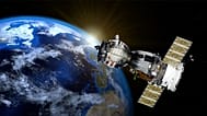 A satellite hovers above the Earth