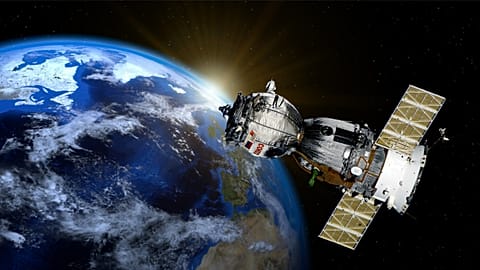 A satellite hovers above the Earth