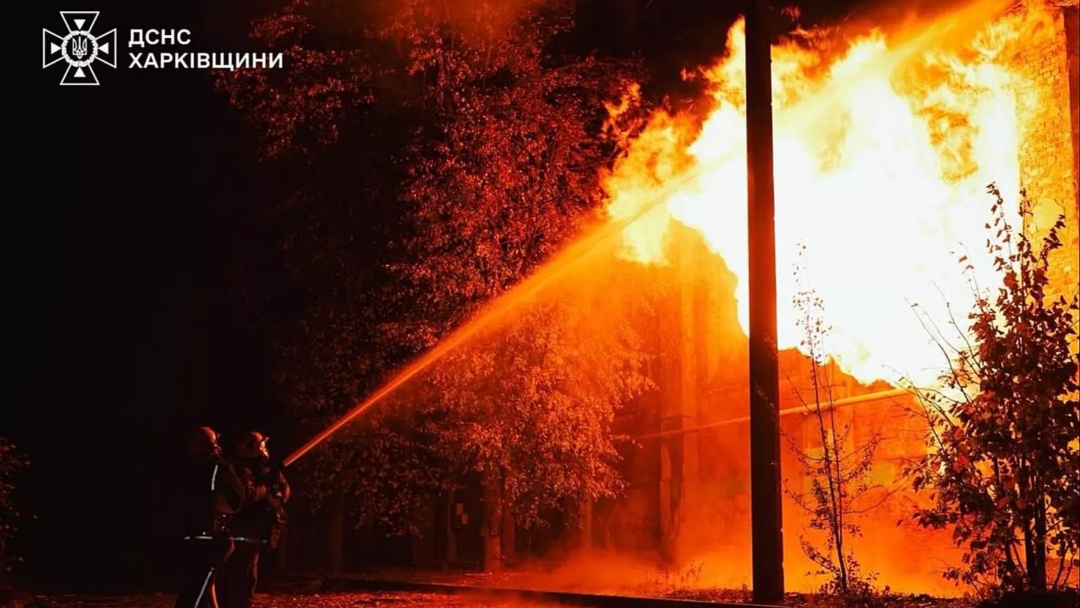 Rescue workers put out a fire of a hospital damaged by a Russian strike in Kharkiv, 14 October, 2025