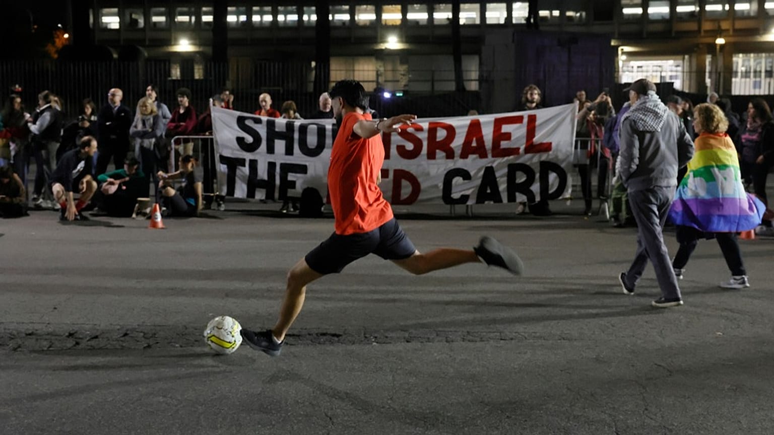 People protest against the participation of the Israeli national team in the 2026 Soccer World Cup qualification match against Italy in Rome, Oct. 14, 2025.