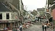 Royal Ulster Constabulary Police officers stand on Market Street, the scene of a car bombing in the centre of Omagh, Co Tyrone,Northern Ireland, on Aug. 15, 1998. 