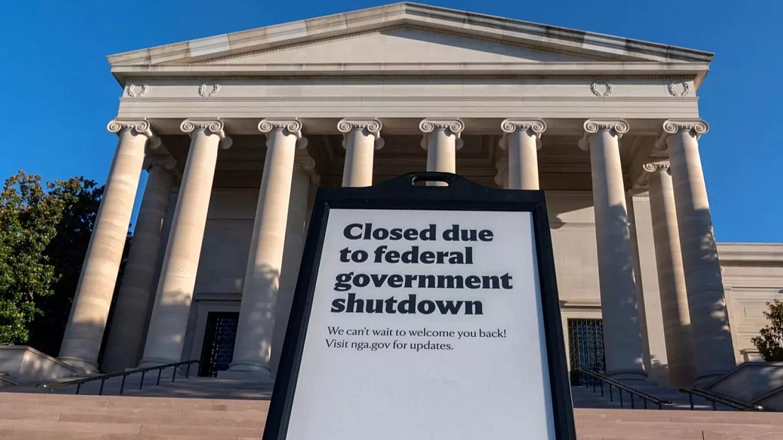 FILE - A sign that reads "Closed due to federal government shutdown," is seen outside of the National Gallery of Art in Washington, Oct. 6, 2025. (AP Photo/Jose Luis Magana, F