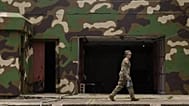 FILE: A US service member walks past a former military battery during joint drills at Fort Sherman, a former US Army base, in Colon, 19 August 2025