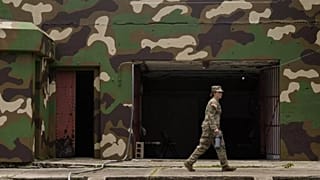 FILE: A US service member walks past a former military battery during joint drills at Fort Sherman, a former US Army base, in Colon, 19 August 2025
