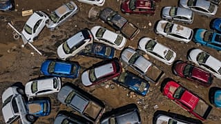  Damaged vehicles sit in mud after flooding in Poza Rica, Veracruz state, Mexico