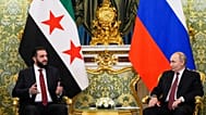 الرئيس الروسي فلاديمير بوتن والرئيس السوري المؤقت أحمد الشرع يتحدثان خلال لقائهما في قصر الكرملين الكبير في موسكو، روسيا، الأربعاء 15 أكتوبر/تشرين الأول 2025.