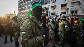 Fighters from the Qassam Brigades, the military wing of Hamas, in Gaza City, 19 January, 2025