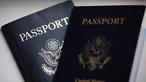 US passports are arranged for a photograph in Tigard, Ore., Dec. 11, 2021.