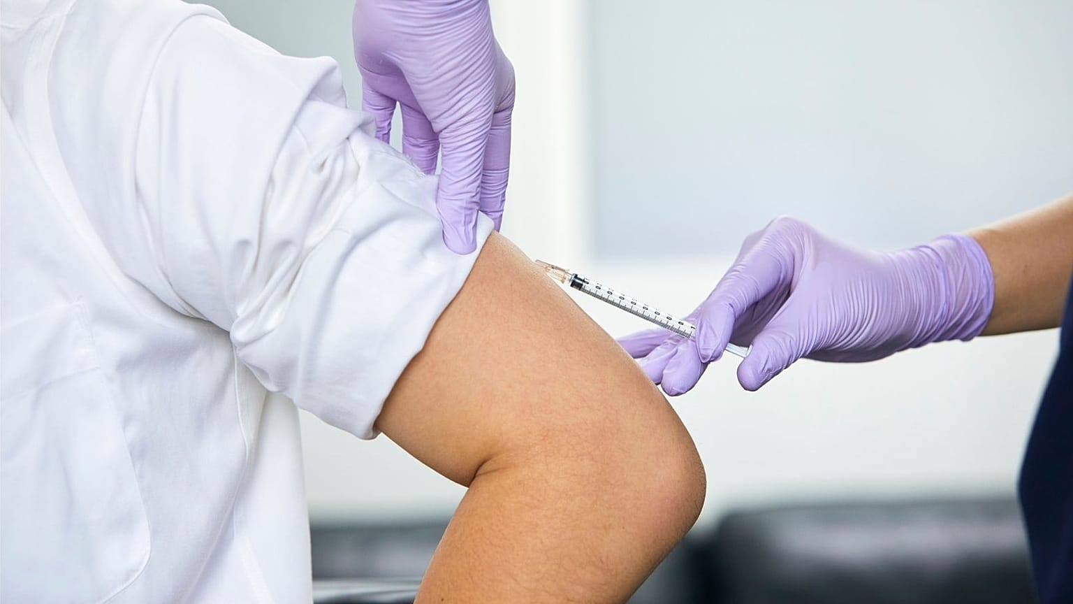 A man receives a jab.