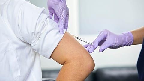A man receives a jab.