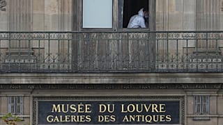 A police officer works inside the Louvre museum, Sunday, Oct. 19, 2025 in Paris. 