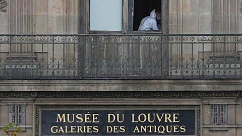 A police officer works inside the Louvre museum, Sunday, Oct. 19, 2025 in Paris. 