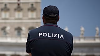Italian police officer stands in Rome, 10 July 2016
