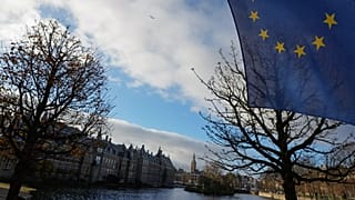 FILE: A European Union flag flies outside parliament building in The Hague, 23 November 2023