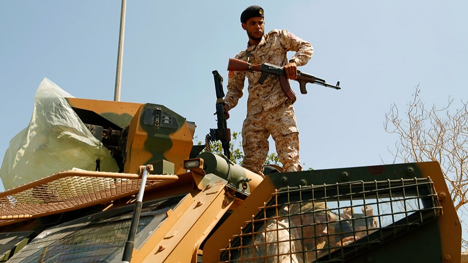 Libyan army forces and vehicles are stationed in a street in the country’s capital of Tripoli on Friday, 22 July 2022 