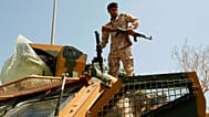 Libyan army forces and vehicles are stationed in a street in the country’s capital of Tripoli on Friday, 22 July 2022