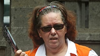 FILE - In this Jan. 7, 2013, file photo, Lindsay Sandiford of Britain fans herself as she arrives at the courthouse for a hearing in Denpasar, Bali island, Indonesia.