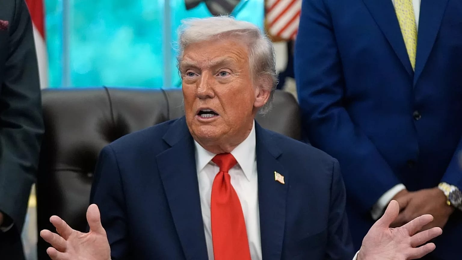 Trump answers questions from reporters during a Diwali celebration in the Oval Office at the White House, Tuesday, Oct. 21, 2025, in Washington.