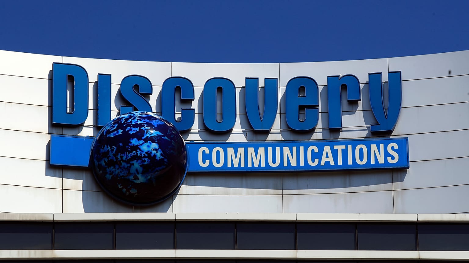 FILE - The Discovery Communications logo atop its headquarters in Silver Spring, Maryland. 2017.